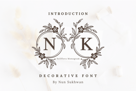 wedding sign fonts example: Nellflora Monogram font specimen